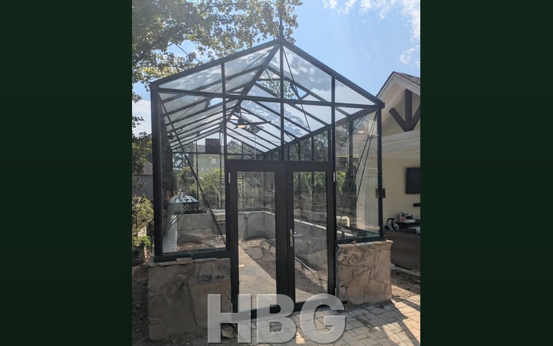 Royal Victorian VI36 Hybrid greenhouse on a stone knee wall in Gwinnett County, GA